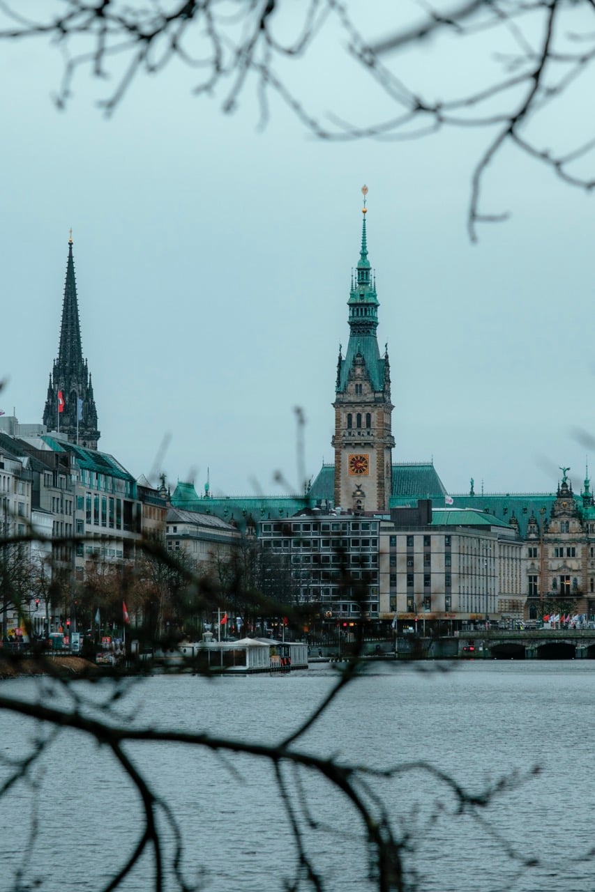 A view of the city hall in Hamburg from a lake