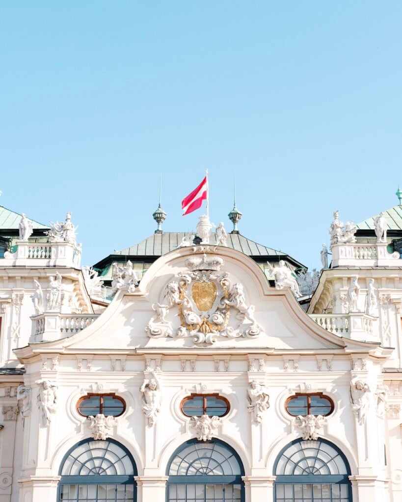 Close-up photo of Belvedere Palace in Vienna, with the Austrian flag clearly flying