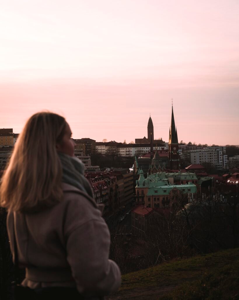 Photo of a woman looking at Gothenburg from Skansen