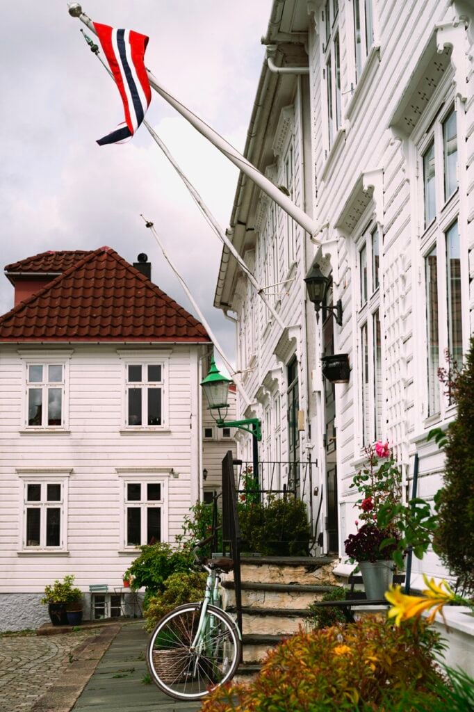 Wooden houses, a flag, and a bike in Bergen, Norway