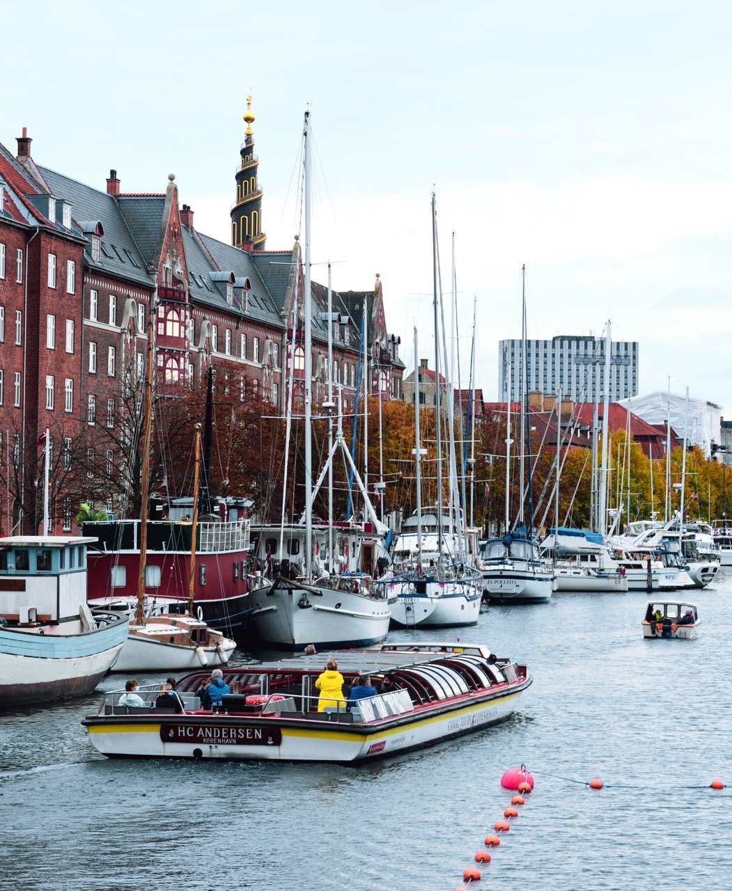 A boat tour going through a canal in Christianshavn, Copenhagen