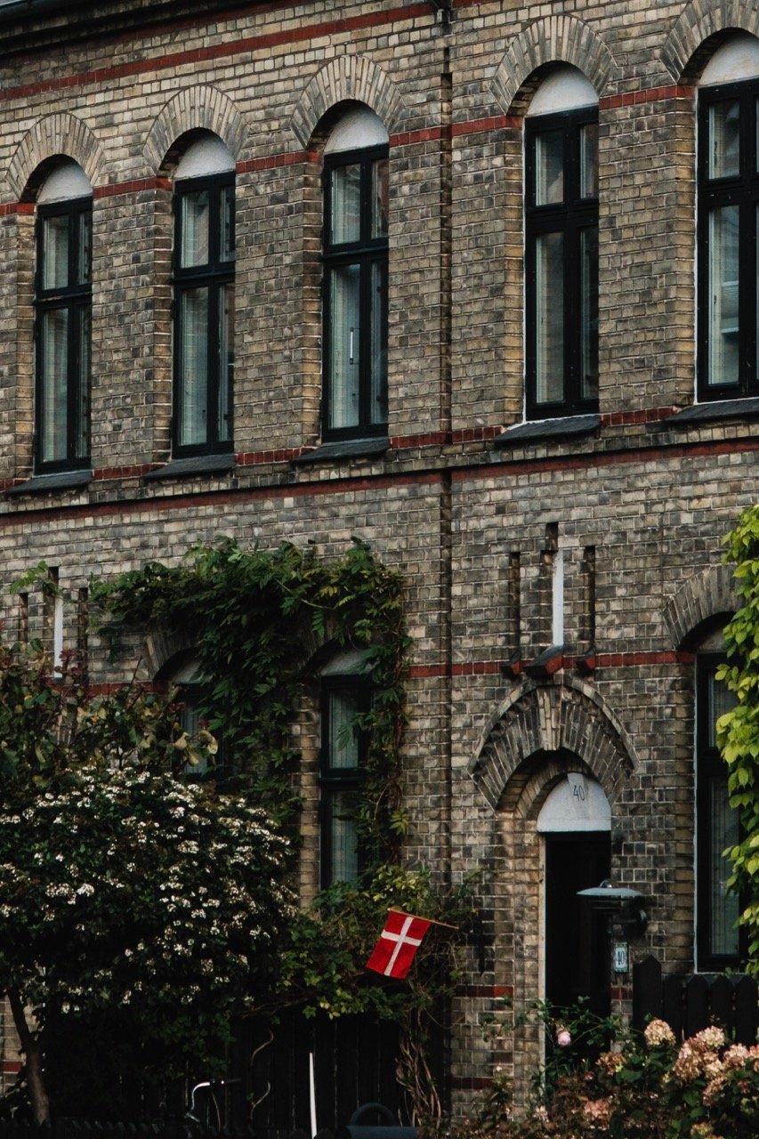 Photo of a Danish flag outside a house in Copenhagen