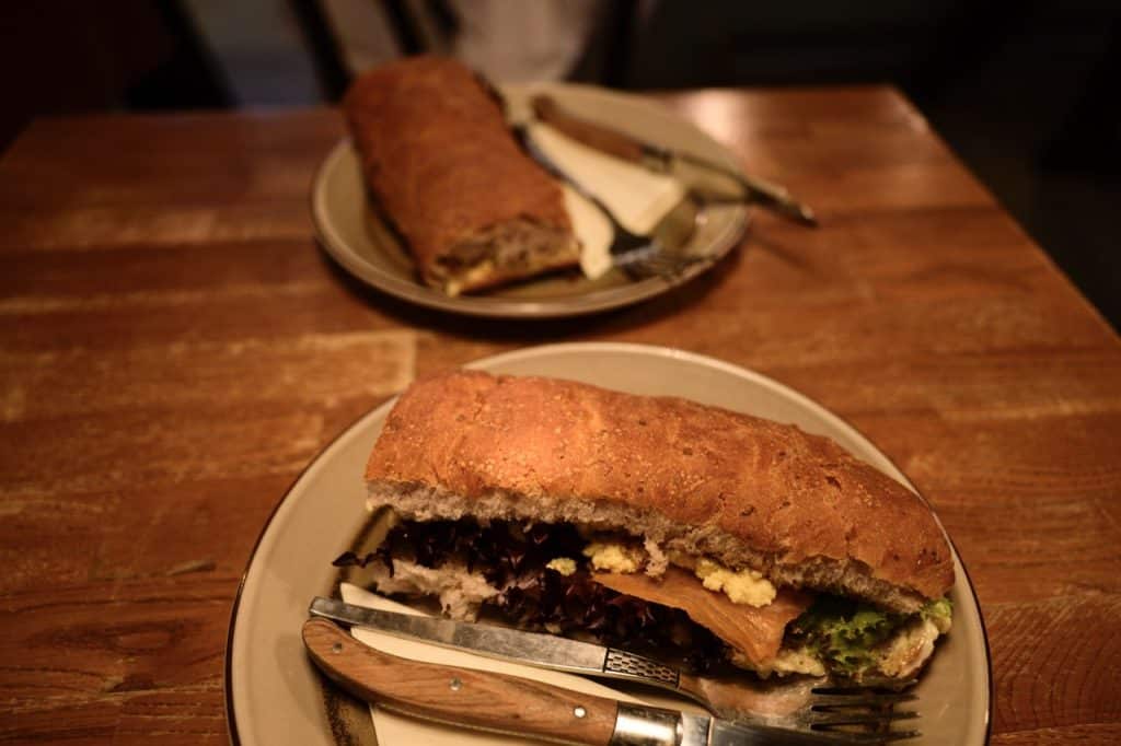 Eating a sandwich at Paname Cafe in Tórshavn