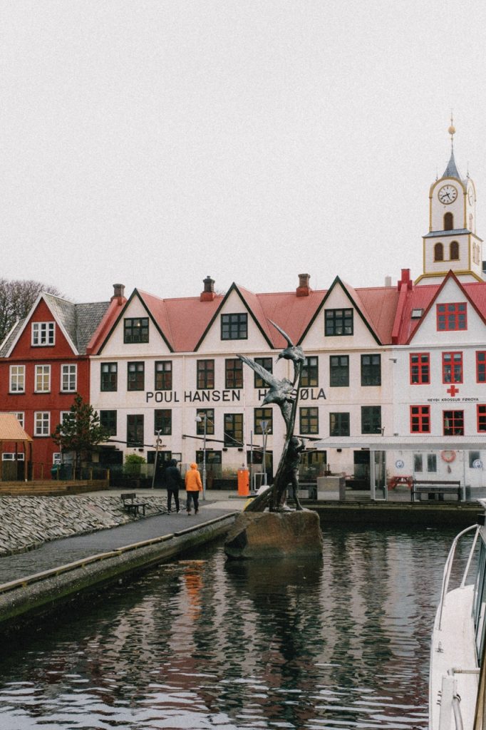 People walking along the old harbour in Tórshavn