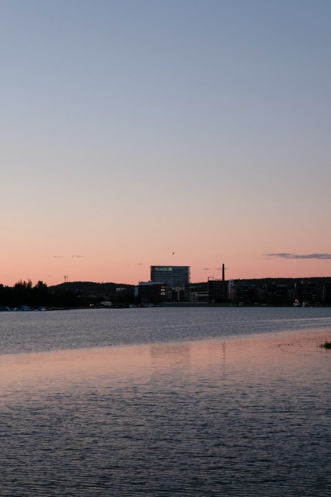A photo showing the lake and some buildings in Jyväskylä, Finland, at midsummer