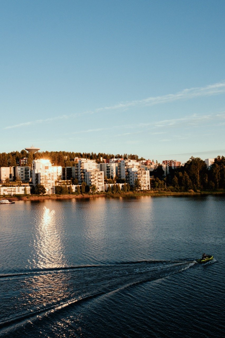 A boat going along the water in Jyväskylä, Finland, on a summer evening