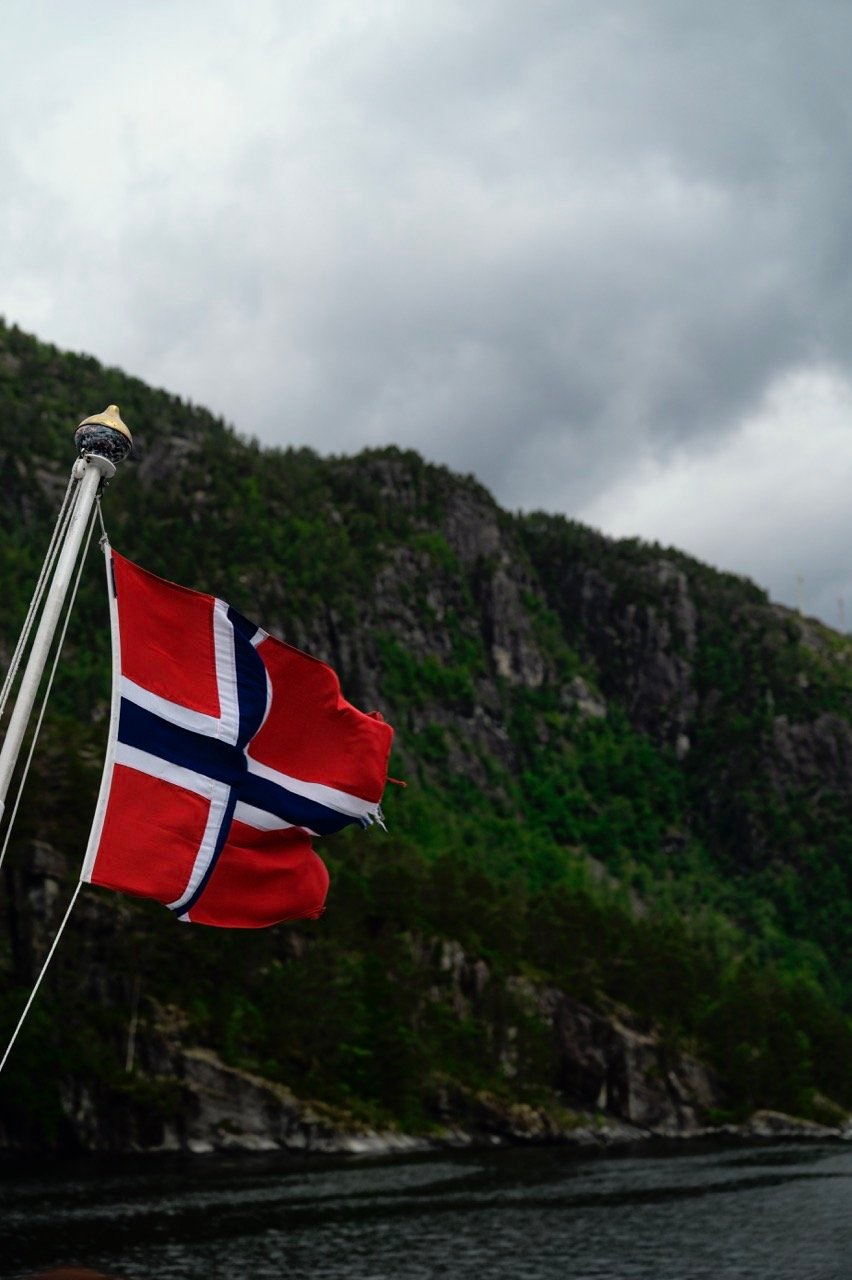 A Norwegian flag on a fjord cruise