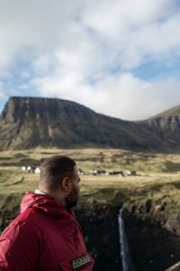 A portrait photo of a man at Gásadalur, Faroe Islands