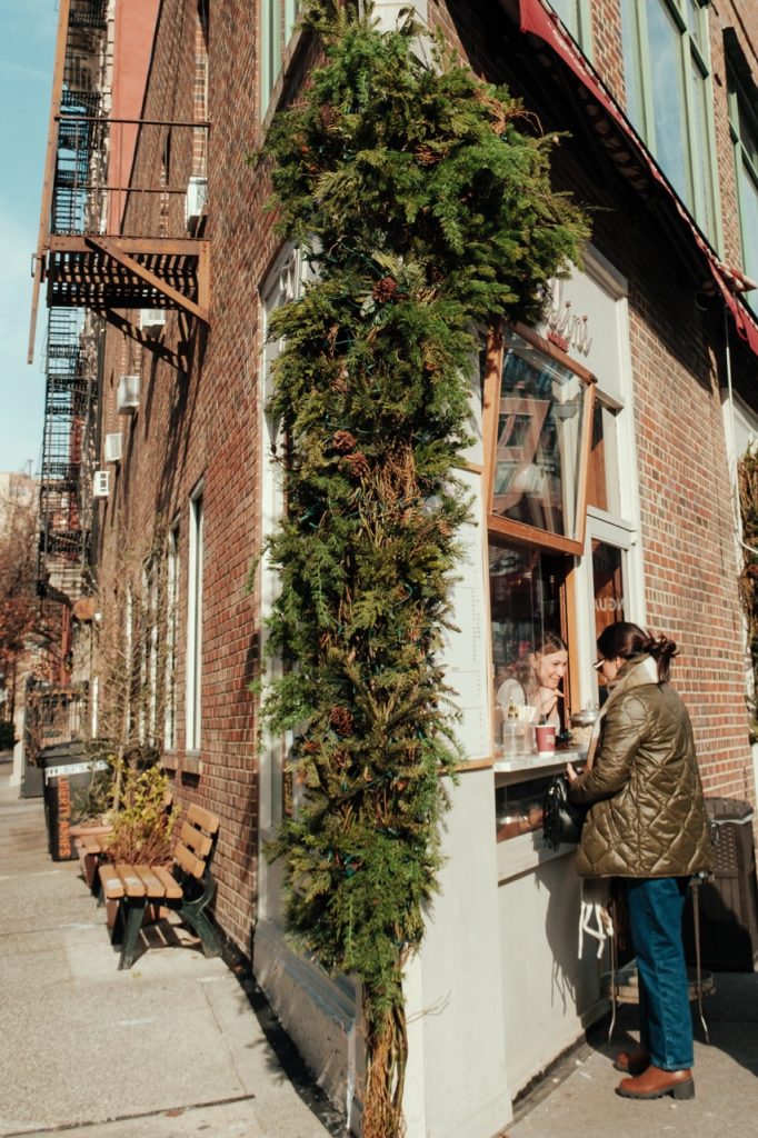 A person buying coffee in Greenwich Village, NYC