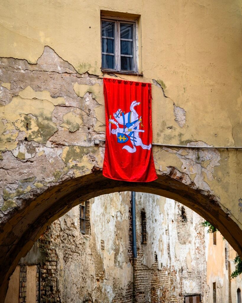 A County of Vilnius Flag Hanging Out a Window in Vilnius, Lithuania