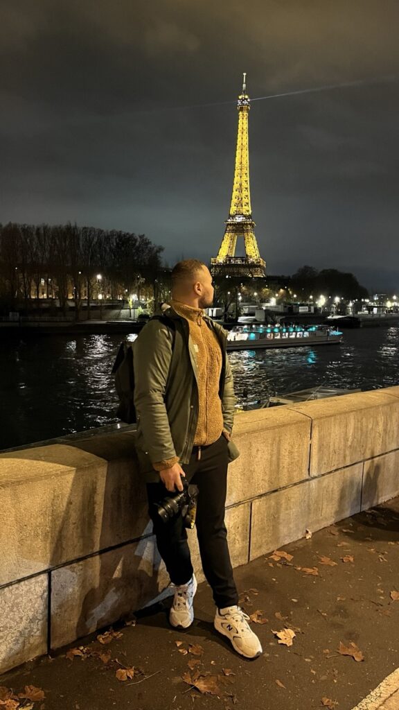 A man looking at the Eiffel Tower in Paris