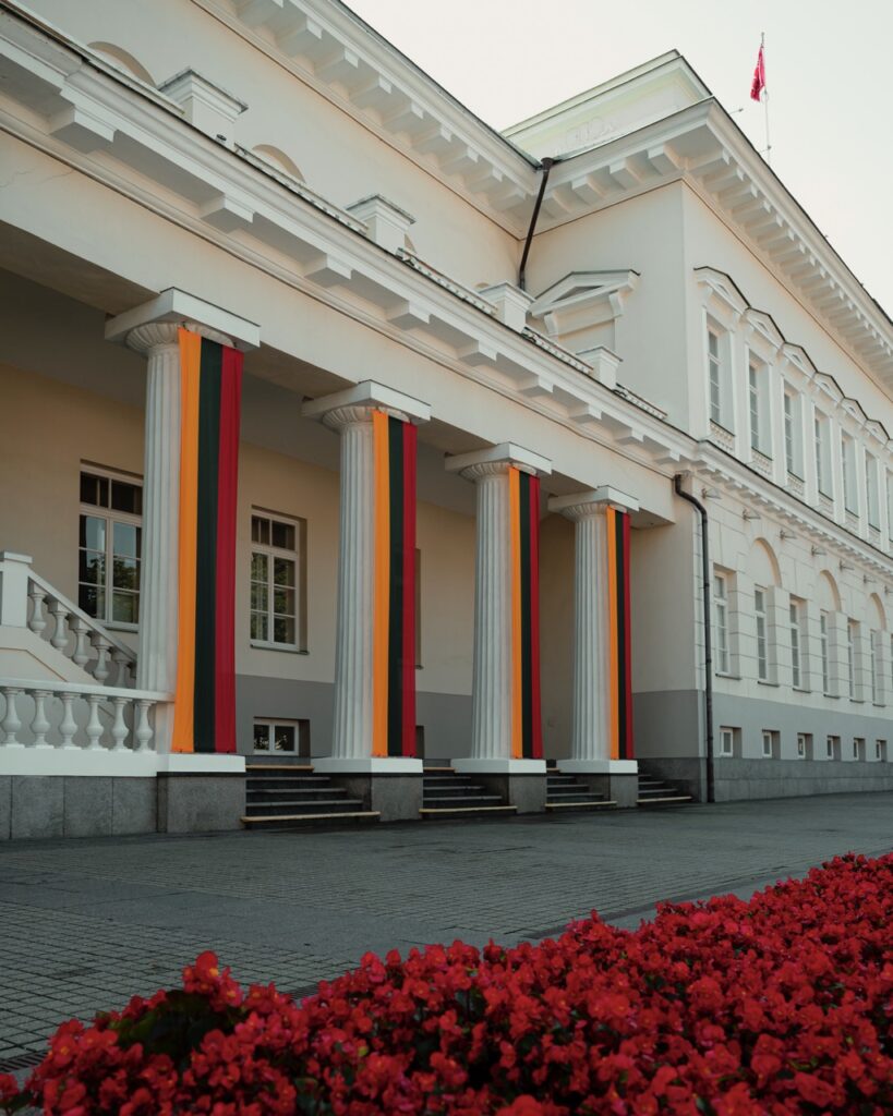 Lithuanian flags outside a building in the Old Town of Vilnius, Lithuania