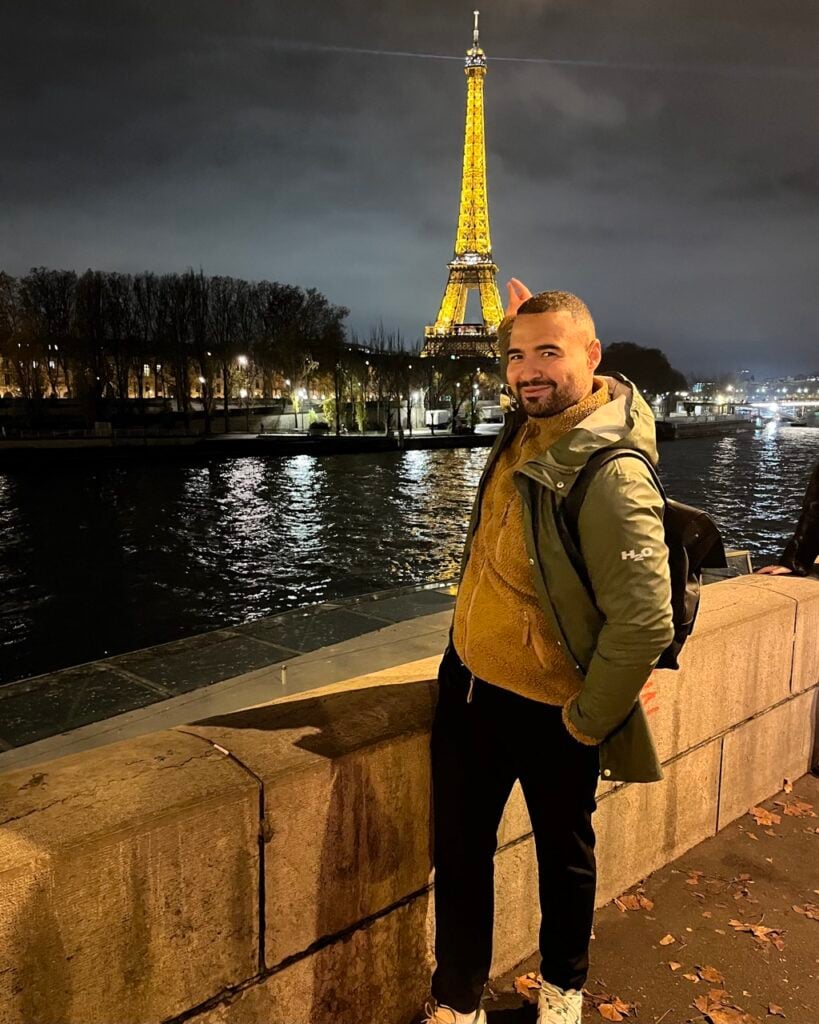 A photo of a man at the Eiffel Tower in Paris, France