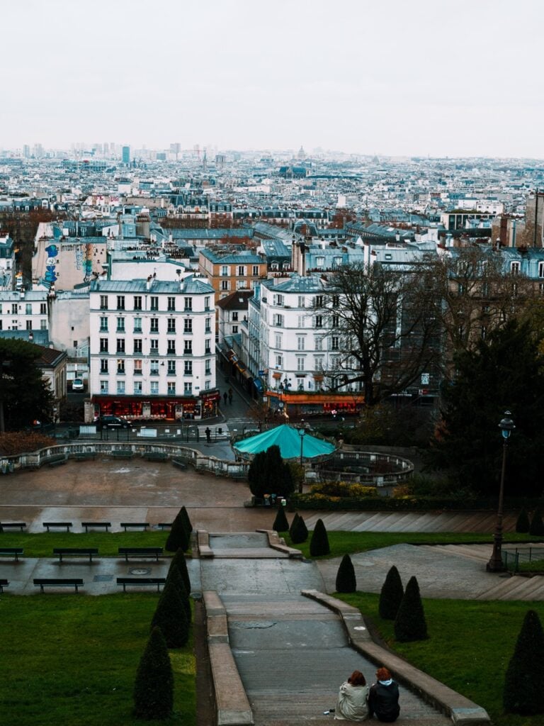 Views in Paris, France, with a couple sitting down