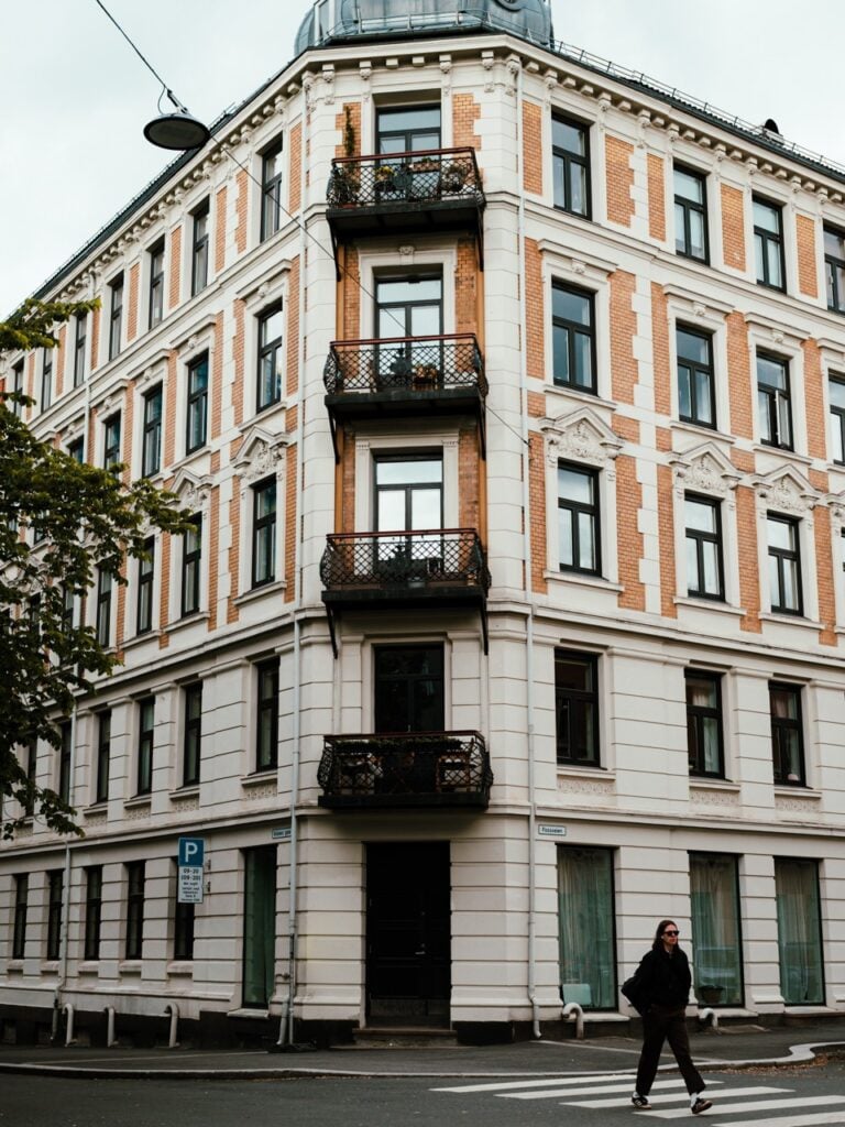 A person crossing the street in Grünerløkka, Oslo, Norway