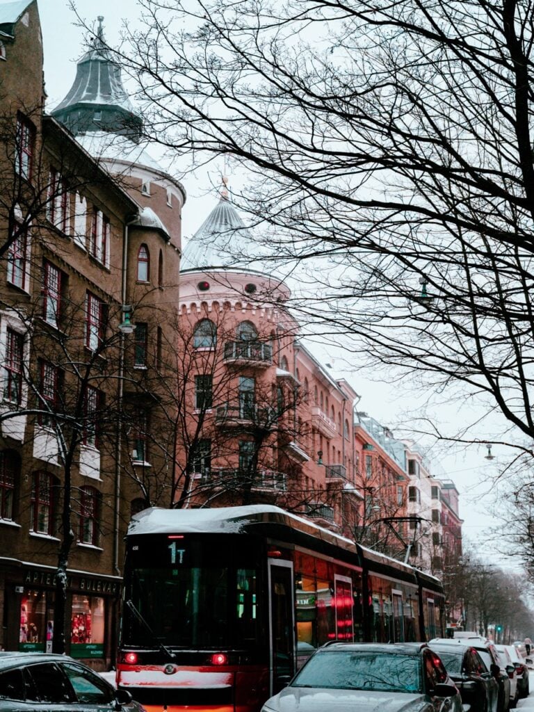 A tram passing through Helsinki on a snowy day