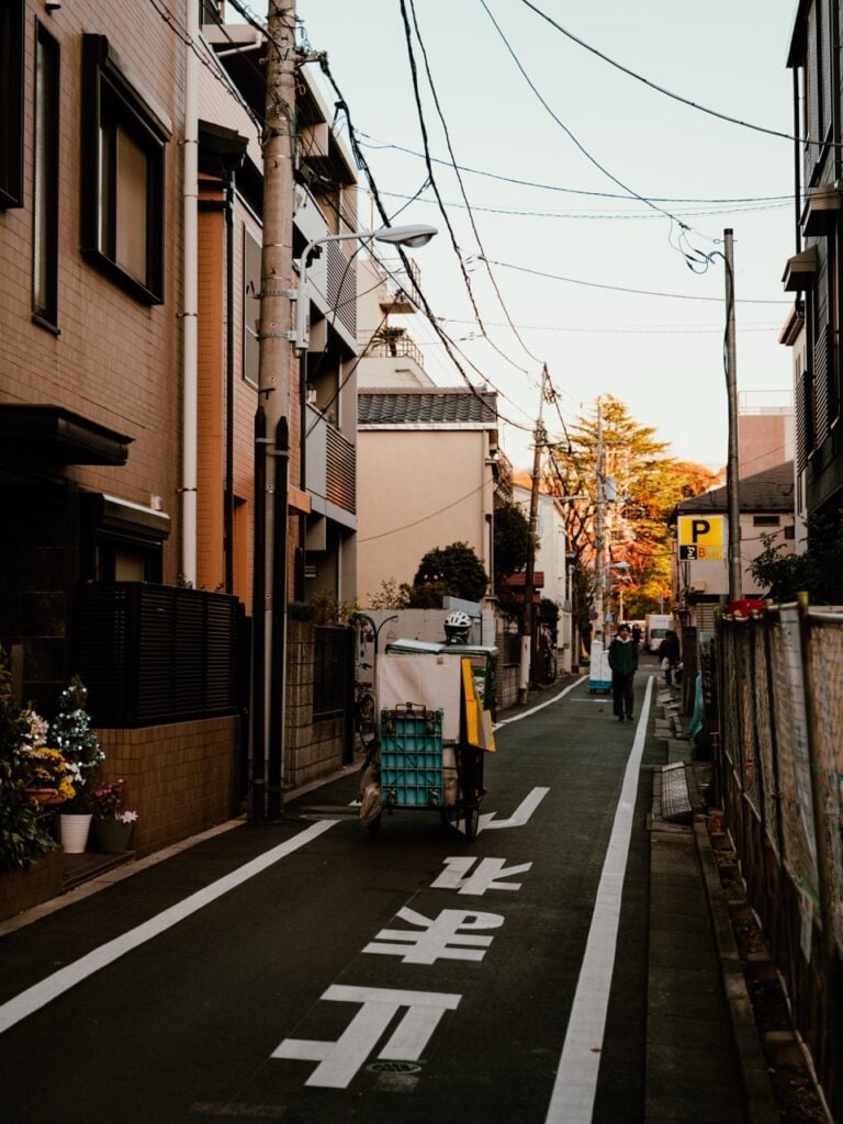A delivery man cycling in Tokyo, Japan