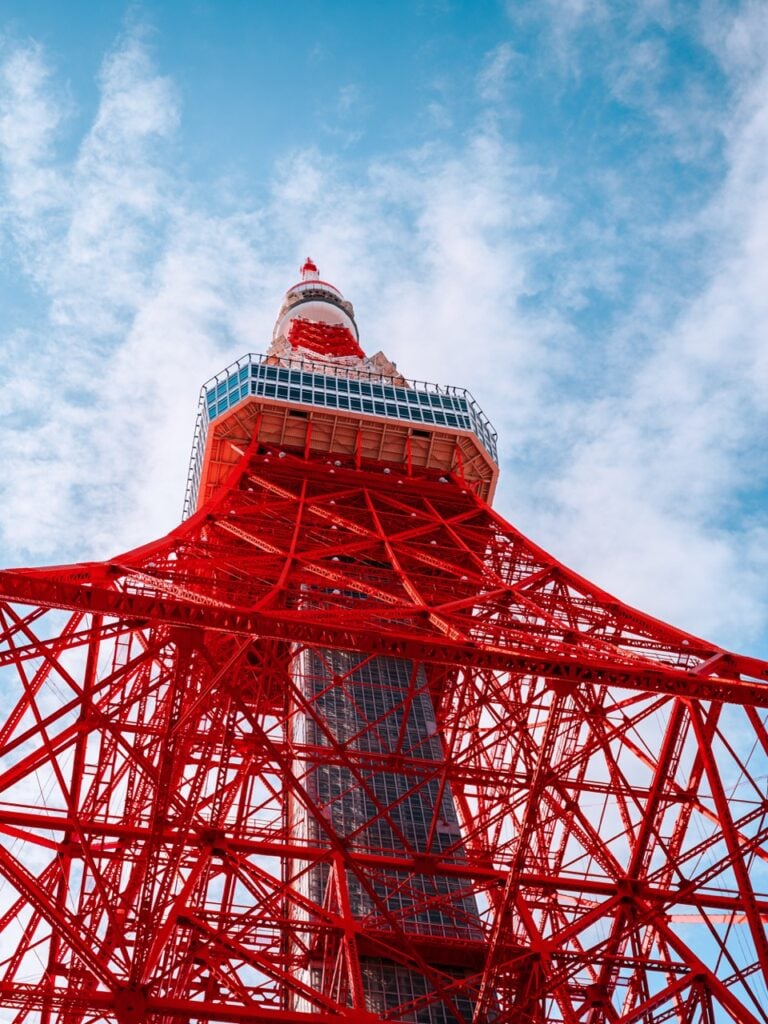 A close-up image of the Tokyo Tower from the ground
