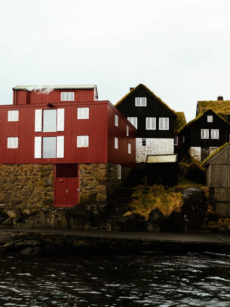 A photo showing some houses along the harbor in Torshavn