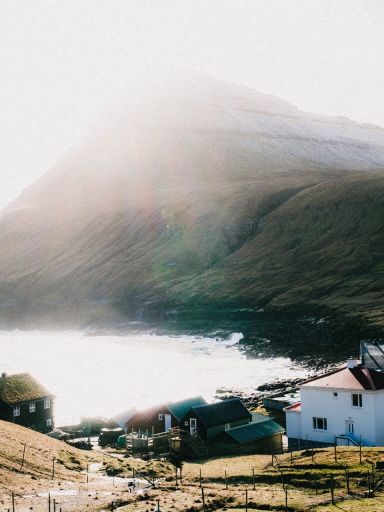 A view of Gjógv, Faroe Islands, with lens flare