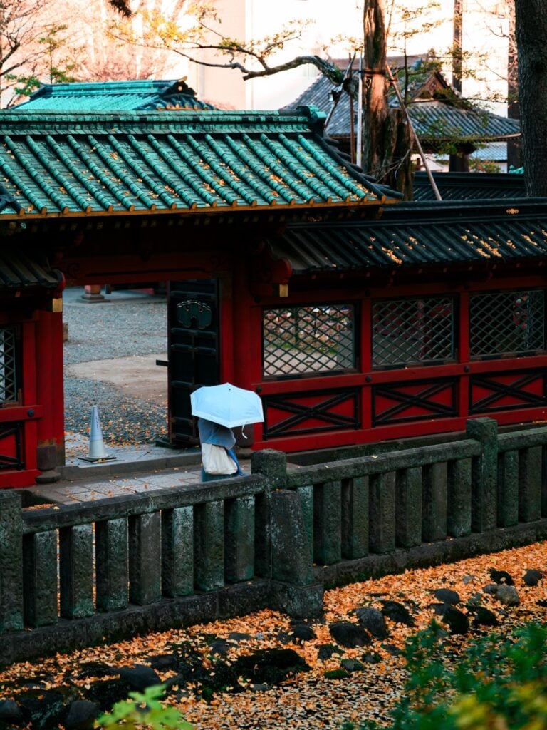 A person walking at the Nezu Shrine in Tokyo, Japan