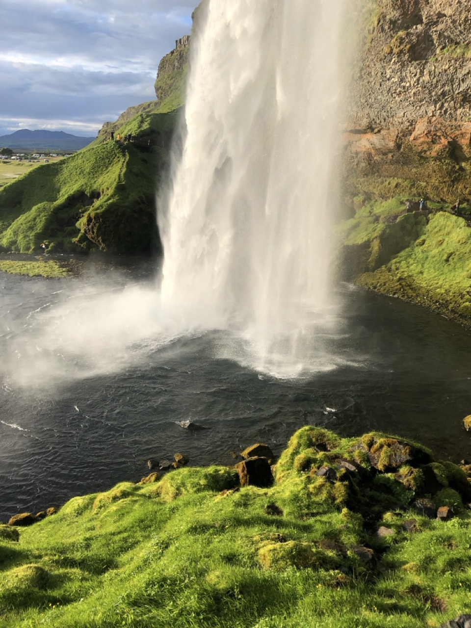The water pouring from Seljalandsfoss, Iceland, in the summer