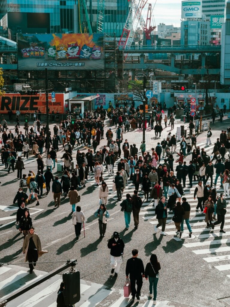 People crossing the street at the Shibuya Crossing in Tokyo