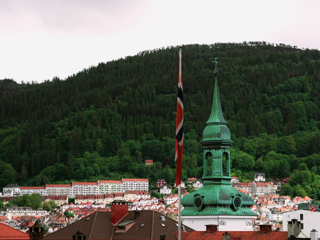 A view of a church and flag in Bergen, Norway