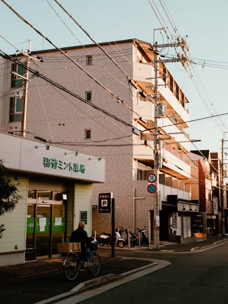 A person cycling in the evening in Kyoto, Japan
