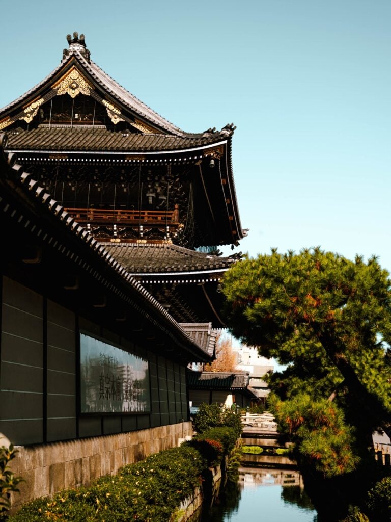 The exterior of a temple in Kyoto, Japan, on a sunny day