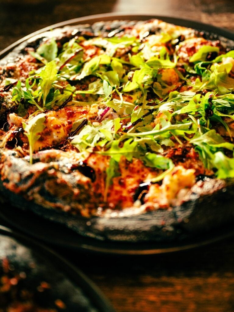 Eating food at the Black Crust Pizzeria in Vík, Iceland