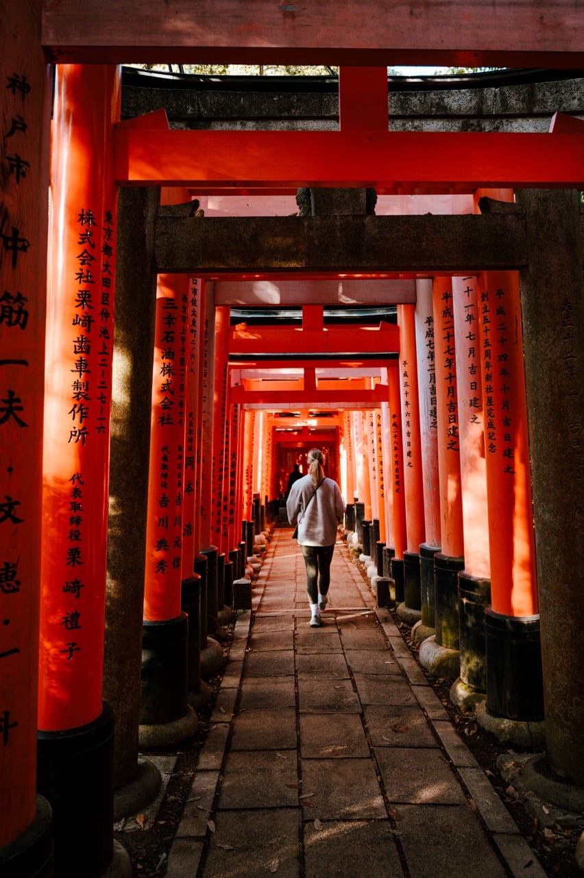 A person walking at the Fushimi Inari Shrine in Kyoto