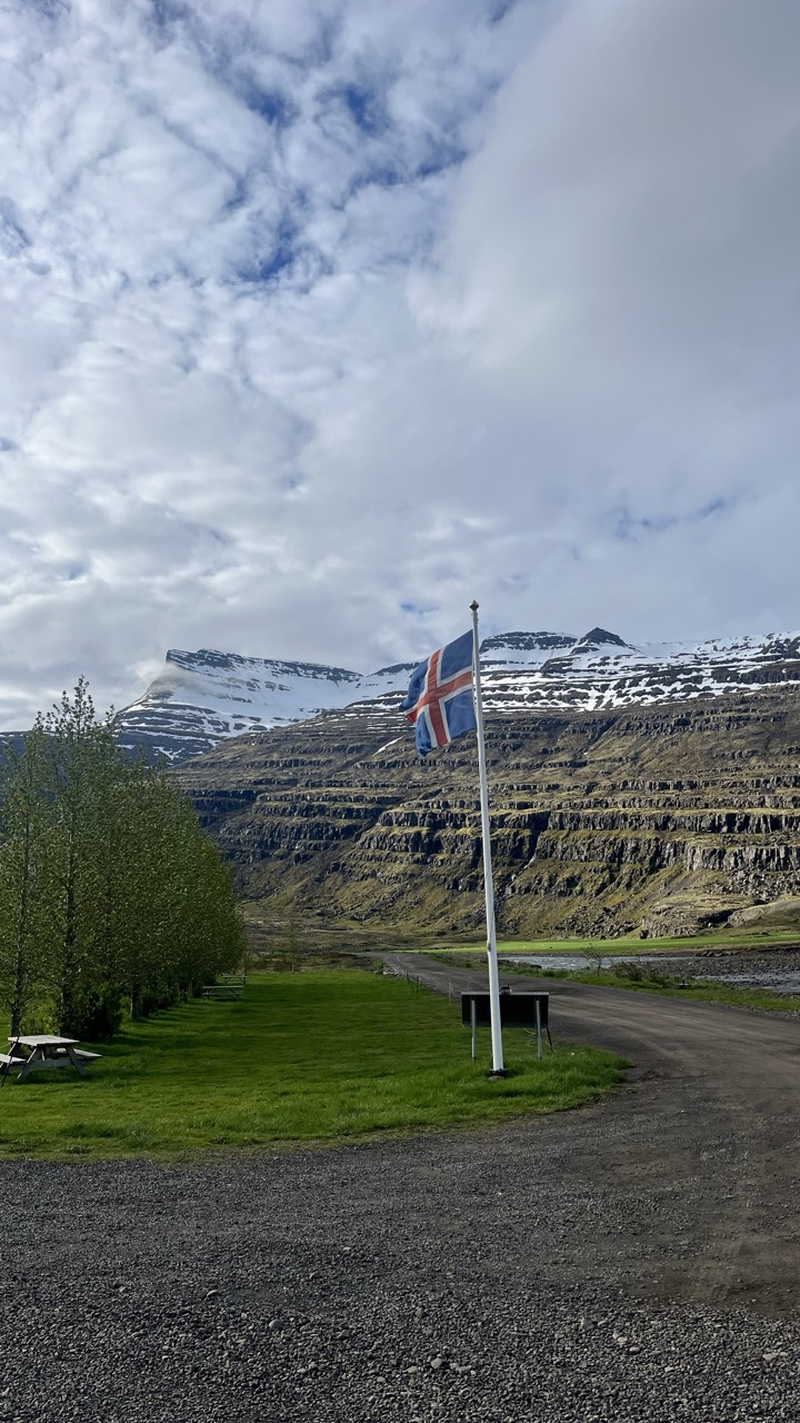 An Iceland flag at a campsite