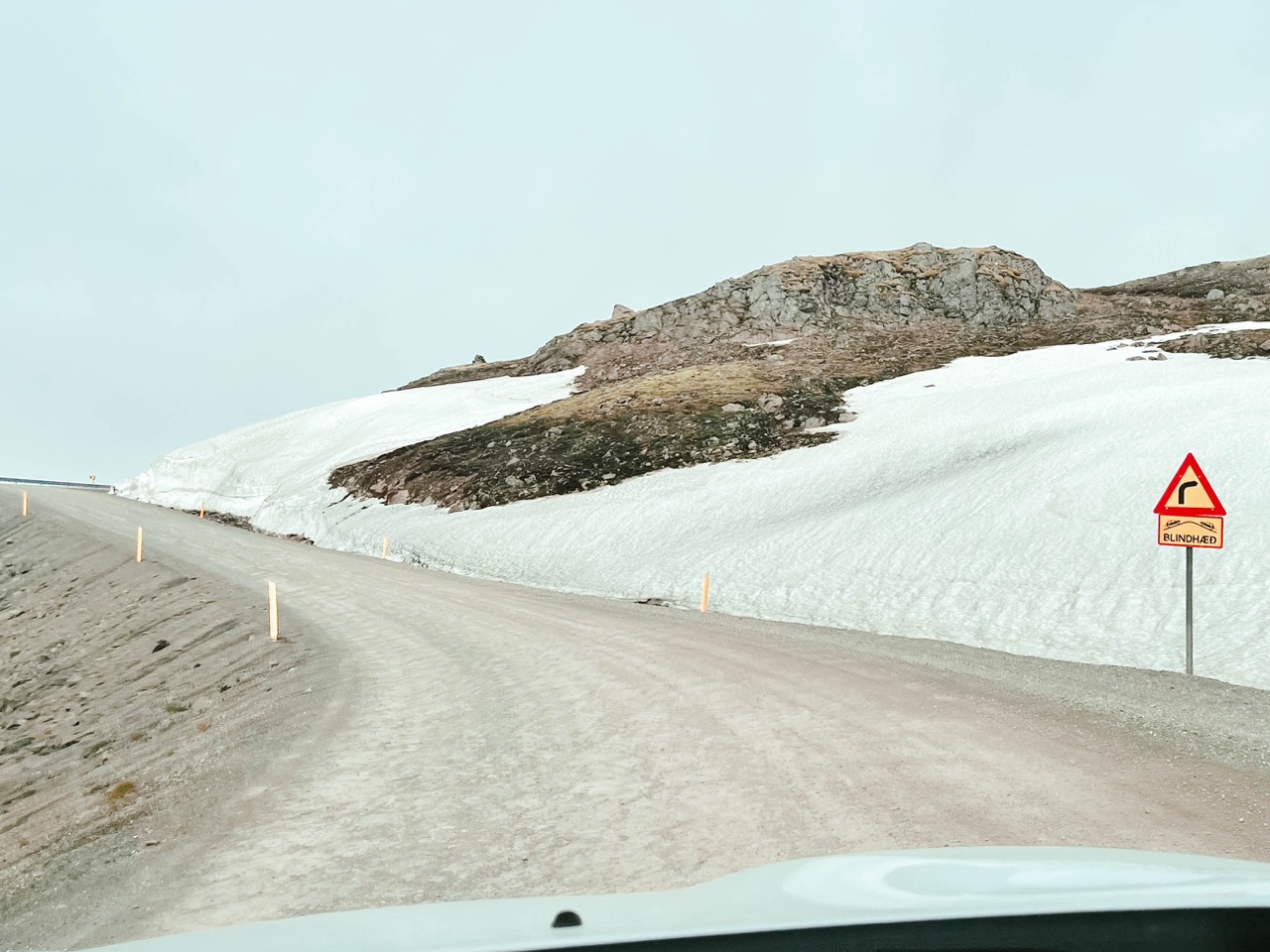 Driving on a mountain road in Iceland with a blind spot
