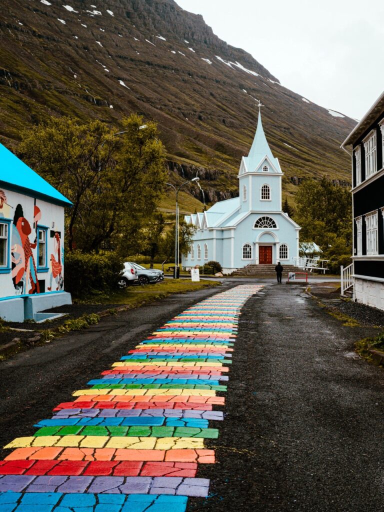 A rainbow road in Seyðisfjörður, Iceland