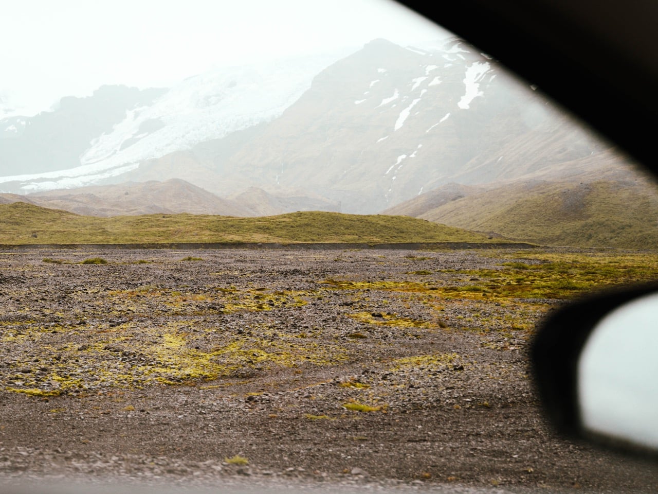 A car driving past a glacier in Iceland