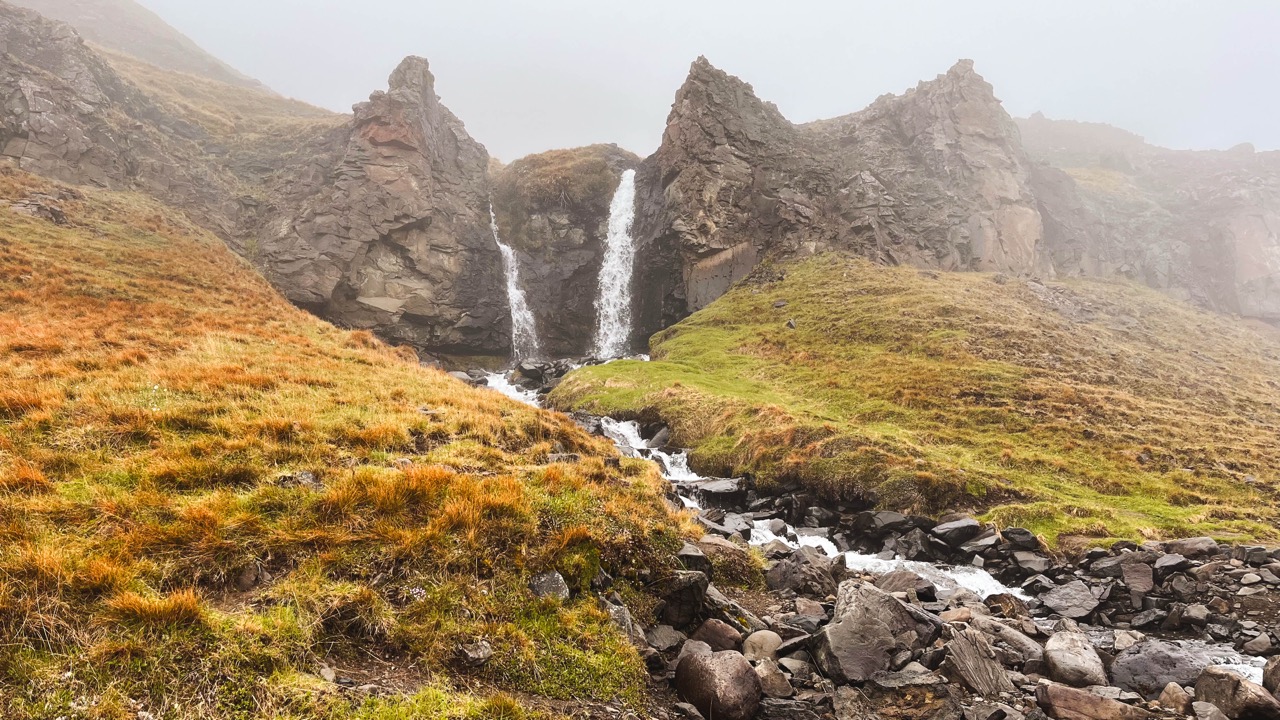 A waterfall in Iceland along a hiking trail