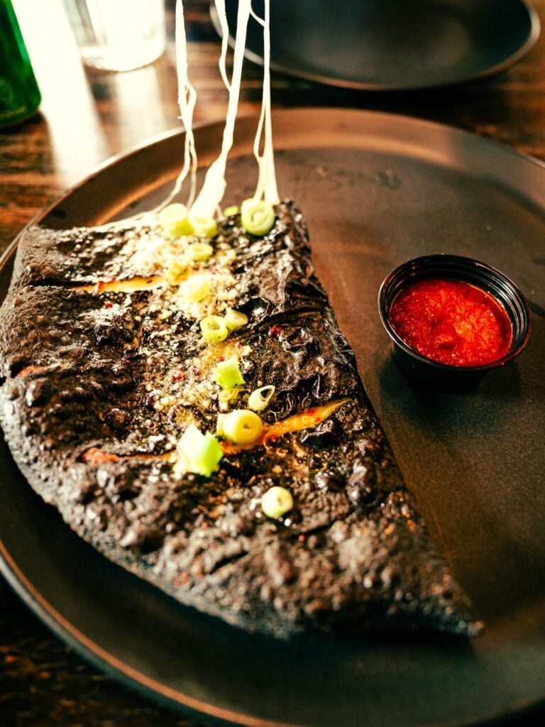 Eating pizza in Vík, Iceland