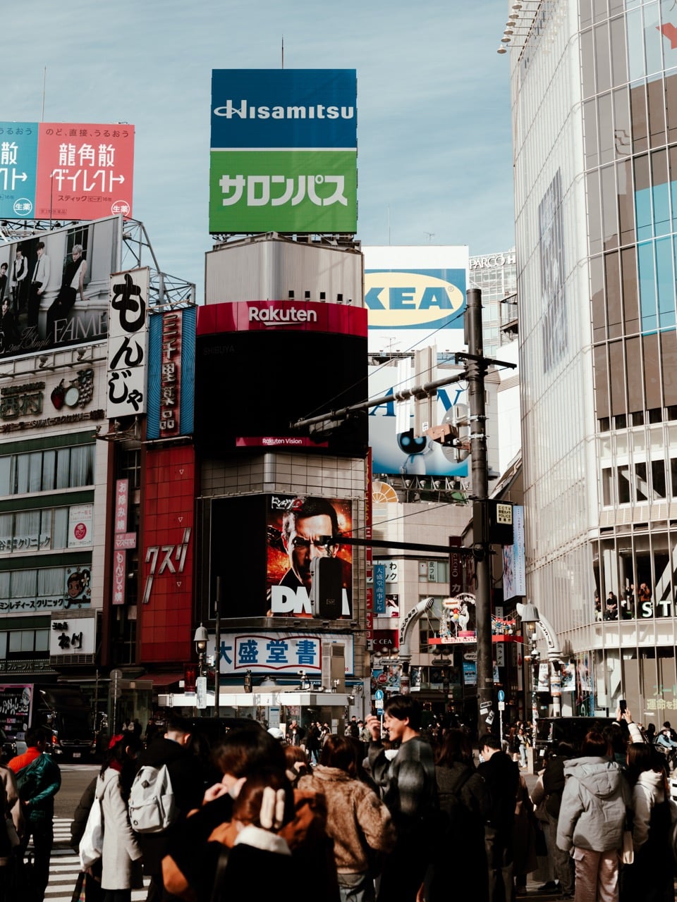 People walking across the Shibuya Crossing in Tokyo