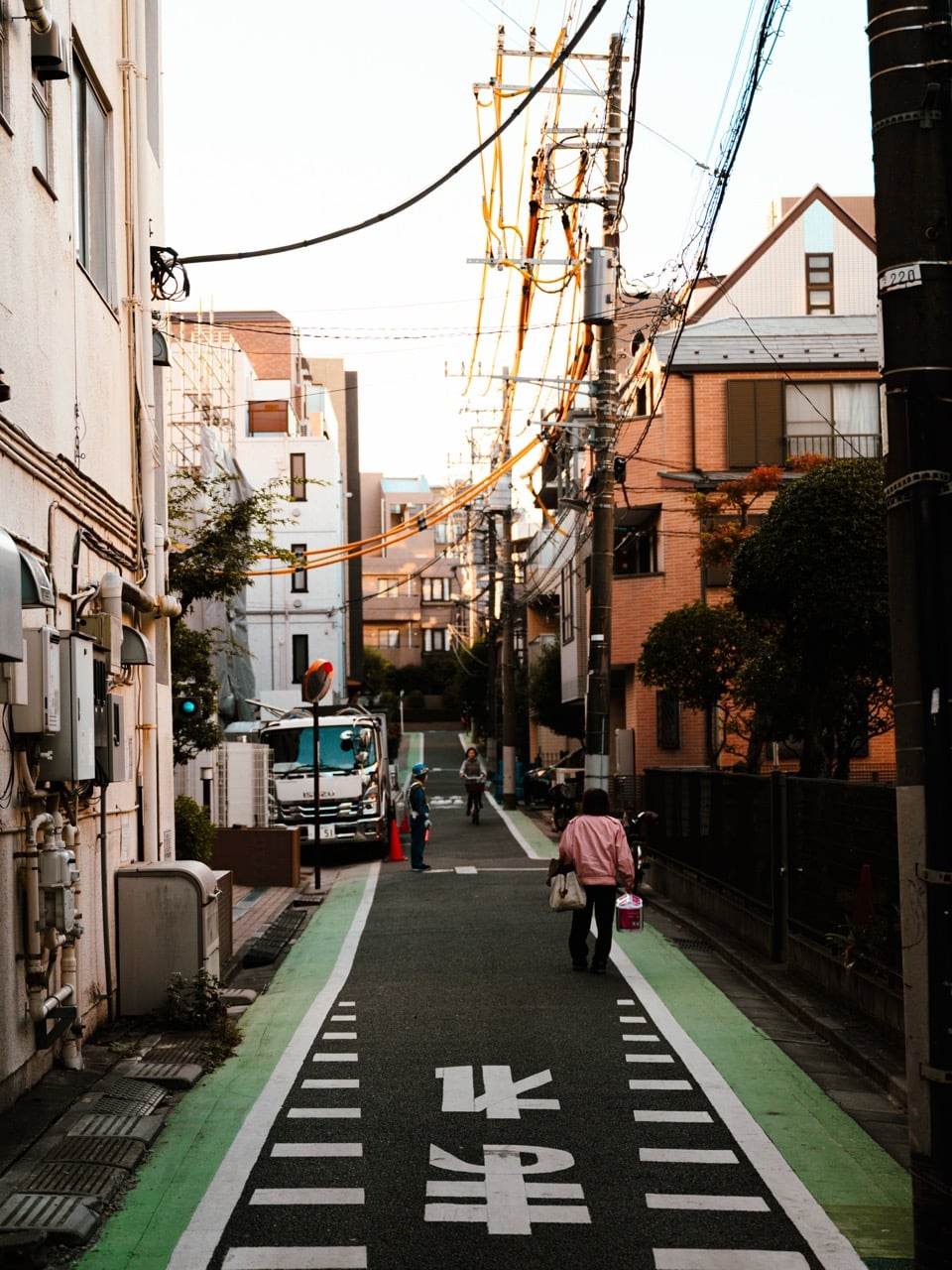 People walking down a street in Tokyo, Japan