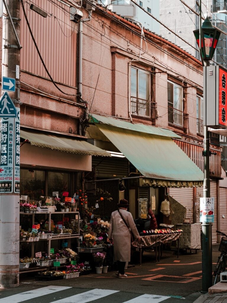 A person walking down a street in Tokyo, Japan