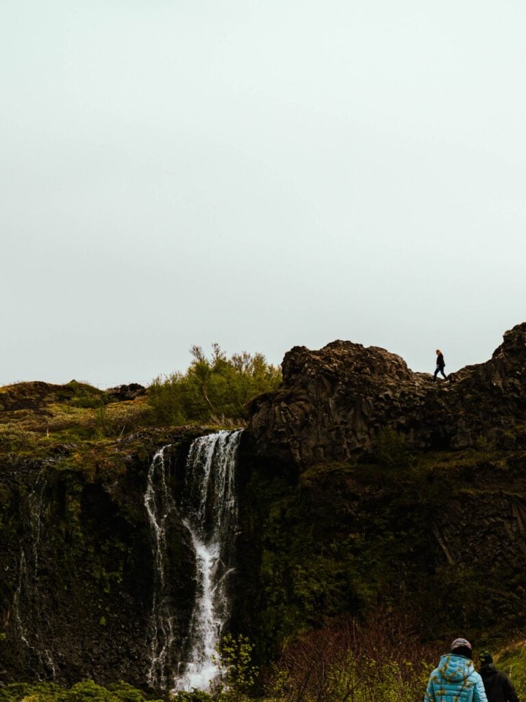 People walking at Gjáifoss in Iceland