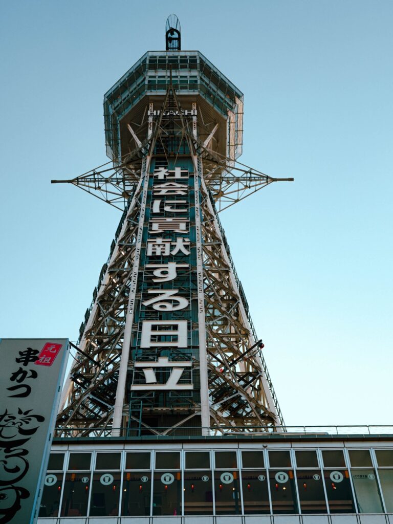 A cyclist near Tsutenkaku in Osaka, Japan