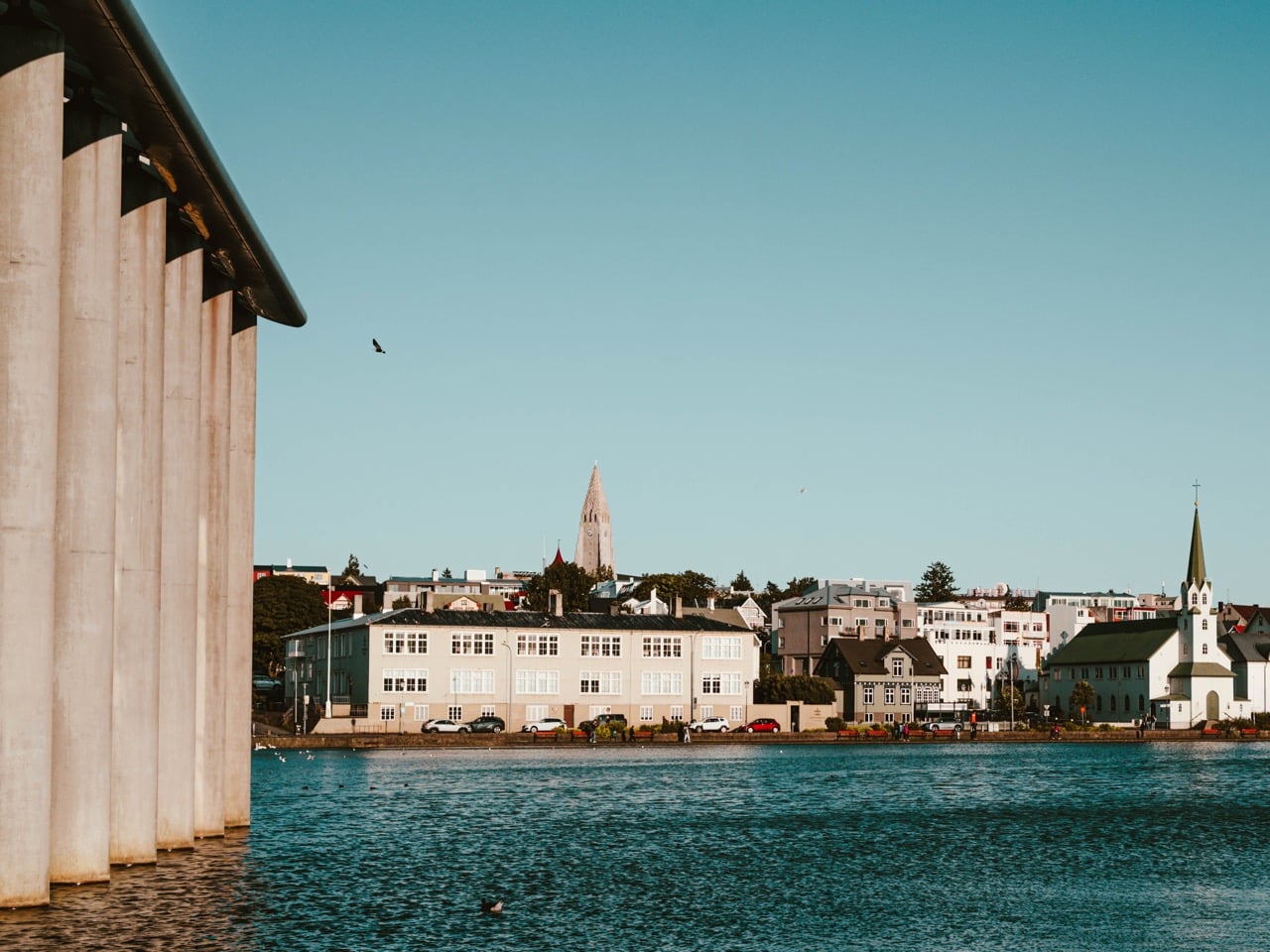Edited photo of Reykjavik City Hall and Hallgrimskirkja seen from the lake